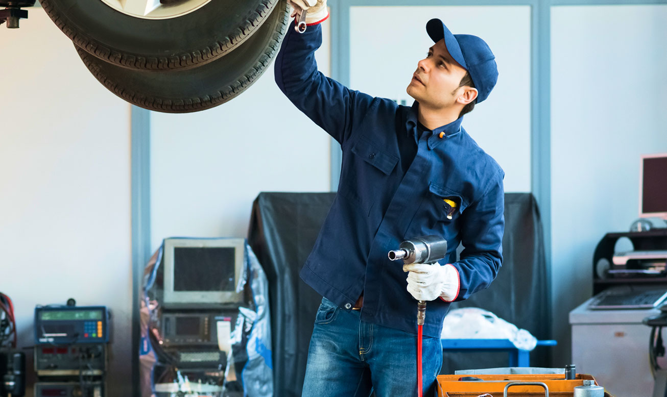 Mechanic Working on Car Mechanic Working on Car